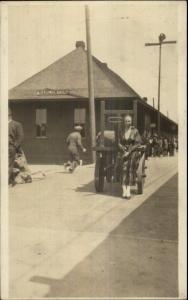 Harlowton MT Woman Poses at RR Train Station AMATEUR Real Photo Postcard spg