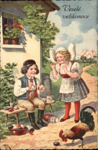Easter Children Boy & Girl Paint Decorate Eggs c1900s-10s Postcard