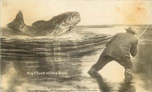 1911 RPPC Postcard Sport Fishing Exaggeration Nip & Tuck with Huge Bass Fish