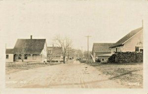 Sutton NH Dirt Street Lumber Yards Houses Dog Real Photo Postcard