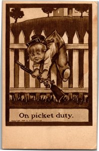 Little Boy with Gun Soldier Hat Stuck on Picket Fence c1910Vintage Postcard A33