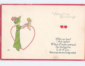 Unused Divided-Back Valentine CUPID HOLDS HANDS WITH WOMAN ALL IN GREEN o5550