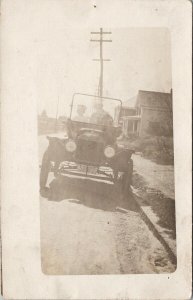 Two People in Old Automobile Massachusetts Plates MA RPPC Postcard H15 *as is