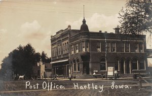 H73/ Hartley Iowa RPPC Postcard c1910 Post Office Building Broders Store69