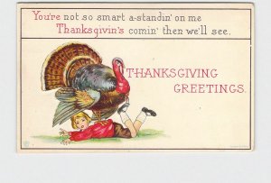PPC POSTCARD THANKSGIVING GREETINGS TURKEY STANDING ON BOY IN RED SHIRT EMBOSSED
