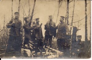 RPPC WWI German Soldiers at Work Chopping Wood, Ax Tools, Uniforms 1915 Feldpost