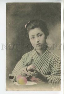 443489 JAPAN Geisha girl in native dress with apples and a glass of wine tinted