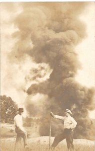 H94/ Occupational RPPC Postcard c1910 Giant Fire Burn Holes Men 154