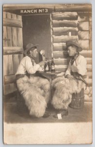Cowboys Card Game Pistols Chaps and Faux Cabin Studio Photo RPPC Postcard L35
