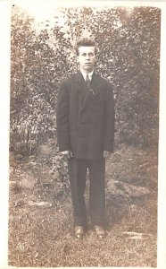 Man in Suit Writing on back 