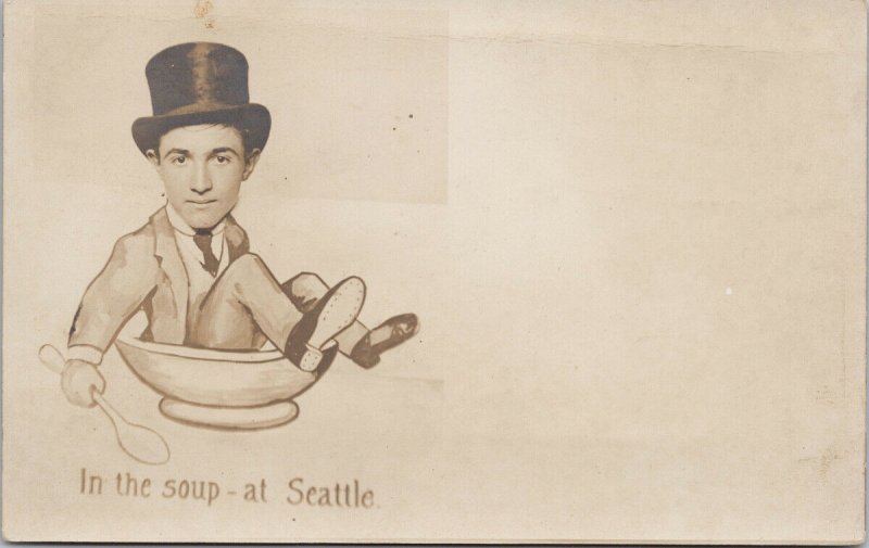 'In The Soup at Seattle' WA Washington Man Hat Sitting in Bowl RPPC Postcard F88