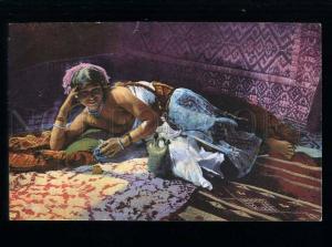 213639 Semi-nude Arabian girl in HAREM carpet Vintage postcard