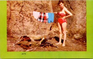 Humour Girl Drying Clothes Over Fire