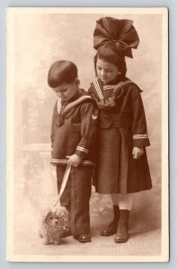 RPPC  Young Kids With Toy Dog  Navy Uniform  c1920    Postcard