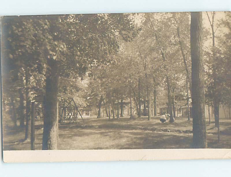 Pre-1918 rppc SWING SET IN WOODED AREA BEHIND THE HOUSE HL9901