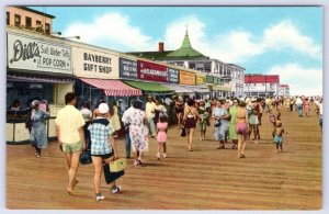 1940-50's REHOBOTH BEACH DE BOARDWALK DILL'S TAFFY NOXZEMA DOLLES SIGNS POSTCARD