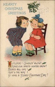 Christmas Little Boy Kisses Little Girl Under Mistletoe c1910 Vintage Postcard