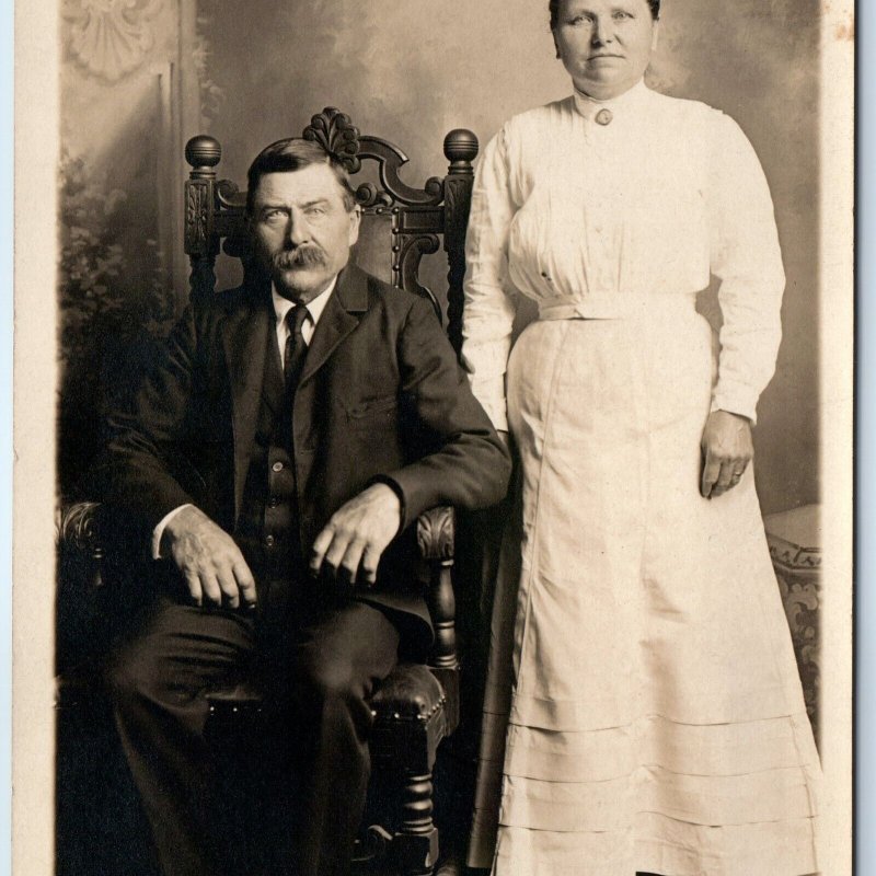 c1910s Middle Aged Married Couple RPPC Man Woman Lady Wood Chair Real Photo A193