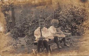 Chilren in Wagon Girl with Teddy Bear Real Photo Antique Postcard J64707