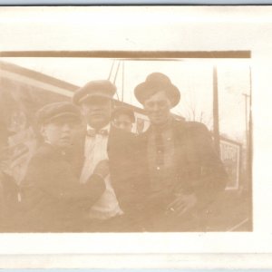 c1910s Group Men Outdoors RPPC Fun Friend Guy Smokes Boy Newsboy Real Photo A261