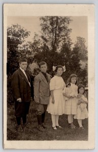 RPPC Edwardian Children Boys Girls With Antique Dolls Real Photo Postcard M28