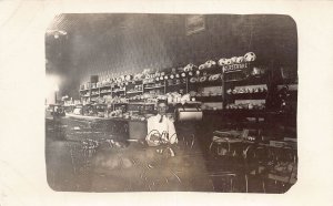 J72/ Interesting RPPC Postcard c1910 Interior Store China Crocks Boy 415