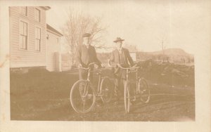 YOUNG MEN PROUDLY DISPLAYING THEIR BICYCLES~1900s REAL PHOTO CYCLING POSTCARD