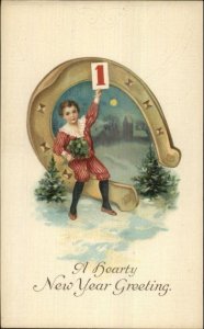 New Year - Little Boy Sitting on Giant Horseshoe c1910 Embossed Postcard