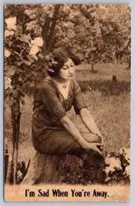 Woman Sitting On Stump, I'm Sad When You're Away, WWI Era Sepia Postcard PU 1915