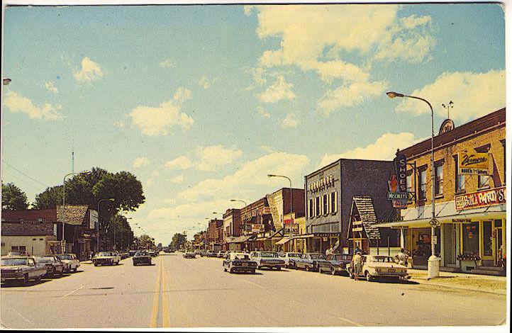 Gaylord MI Main Street Storefronts Rexall Drug Store Old Cars Vintage Postcard