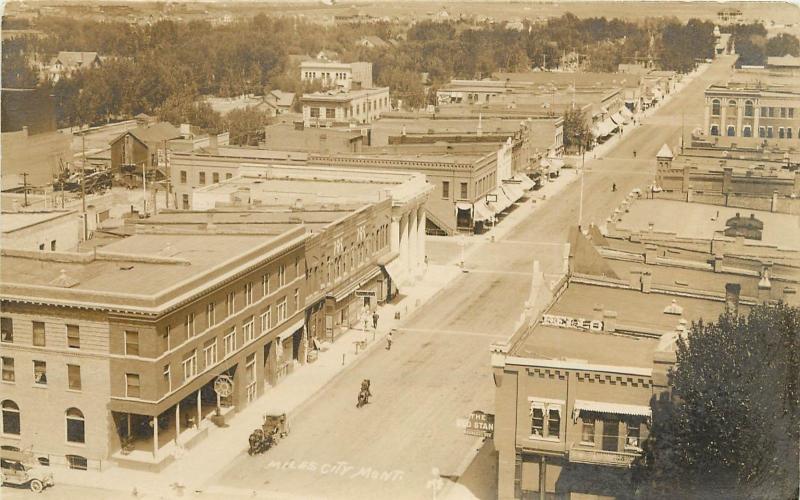 c1910 RPPC Postcard Birdseye view Main Street Scene Miles City MT Custer County