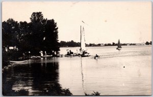 Photo of Boats on Lake Canoe Tree Lined Bank Raft Family Gathering RPPC Postcard