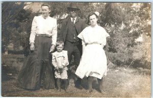 c1910s Family Real Photo RPPC Postcard Man Women Children Evergreen Tree A1