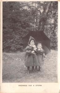 PREPARED FOR A STORM~YOUNG GIRLS & UMBRELLA~LONDON VIEW GREETING POSTCARD 1907