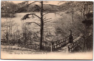 Postcard NJ Lakewood - Bridge by the Lake - Woman standing on bridge