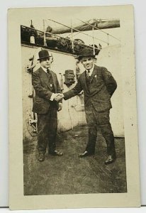 Two Men in Suits on Ship, One Named Hollander A NY Newsboy  RPPC Postcard J4