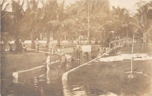 RPPC PHILIPPINES BATHING WASHING SCENE REAL PHOTO POSTCARD (c. 1910)