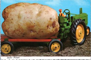 Postcard Exaggeration -Idaho Potato (regular potato on toy tractor)