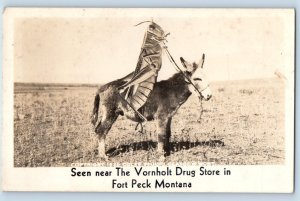 Fort Peck MT Postcard RPPC Photo Grasshopper Ride Donkey The Vornholt Drug Store