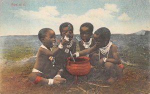 HARD AT IT CHILDREN EATING AFRICA BLACK AMERICANA POSTCARD (1913)