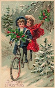 Holiday Attired Boy & Girl Riding Tandem Bicycle~1907 Christmas Postcard