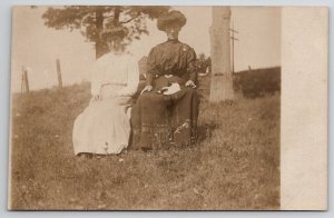 RPPC Victorian Women Gibson Girl Hairstyles Hillside Holding Kitten Postcard A44