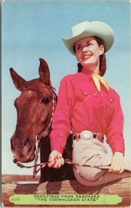 Greetings from Nebraska Cornhusker State Woman & horse Cowgirl 1954 Postcard F85