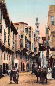 L384 Egypt Cairo donkey carring goods women peasant El-Tabbaneh street postcard