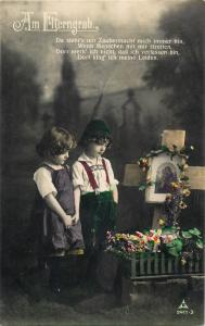 Old tinted real photo postcard Am Elterngrab children couple pray parents grave