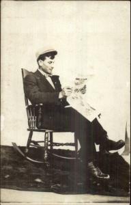 Man in Rocking Chair Reading Minnesota? (I Think) Newspaper c1910 RPPC