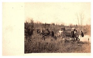 Farmers loading wagon  RPPC