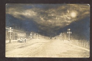 RPPC MILES CITY MONTANA DOWNTOWN STREET SCENE AT NIGHT REAL PHOTO POSTCARD