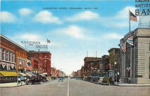 Postcard 1930s Escanaba Michigan Ludington Street autos Kropp flag 24-5868