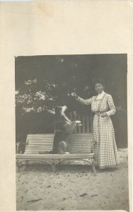 c1910 RPPC People & Pets, Rough Coat Collie Dog Sits up for Smiling Woman